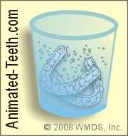 Illustration of cleaning removable orthodontic aligners in a commercial soaking solution.