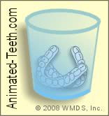 Illustration of cleaning Invisalign® tooth aligners.
